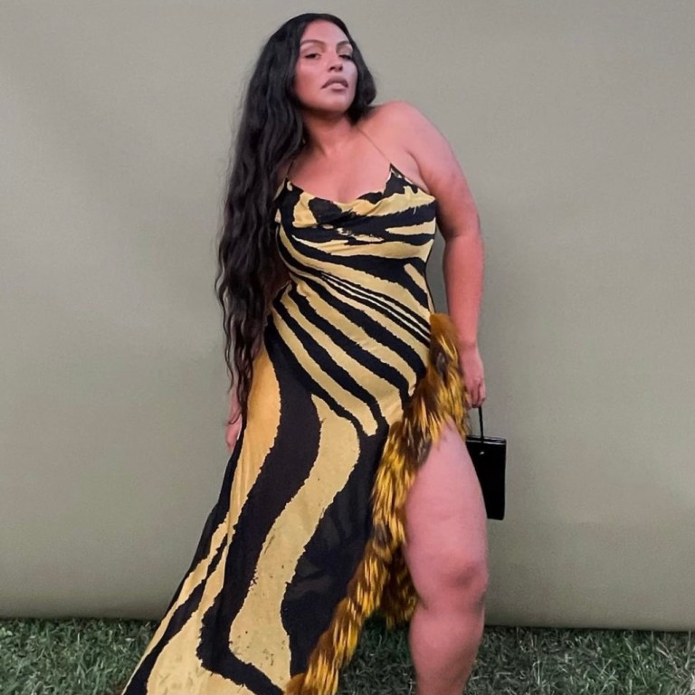 Paloma Elsesser Attends Wedding Wearing Roberto Cavalli FW 2000 Black and Yellow Fur-Trim Zebra Print Gown As Worn by the Late Aaliyah