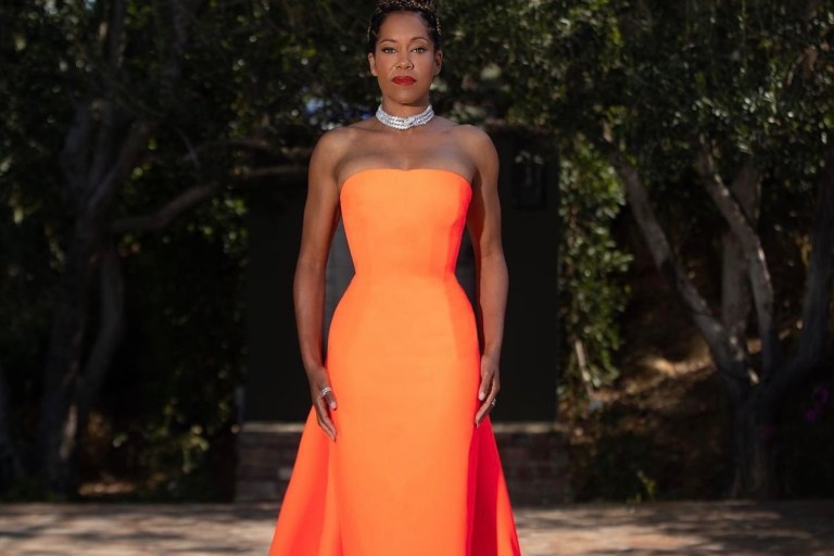 Regina King Continues To Slay Award Season Rocking Christopher John Rogers Orange Strapless Gown With Train for the 2021 Costume Designers Guild Awards