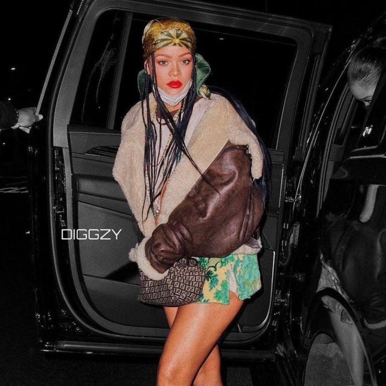 Rihanna Dines at the Nice Guy in LA Wearing R13 Shearling Coat, Wales Bonner Cotton T-Shirt, Vintage Dolce and Gabbana Spring/Summer 2000 Floral Print Skirt, Hermès Vintage 1970s Horse Chariot Carousel Scarf, Fendi Monogram Tote, and Amina Muaddi Green Crystal Ankle Strap Pumps
