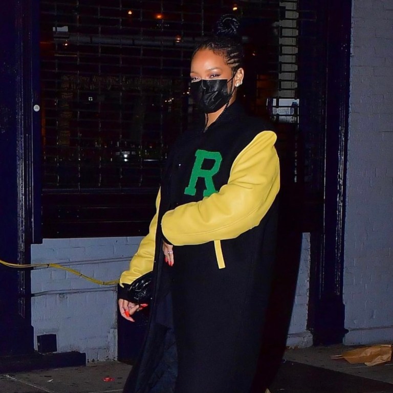 Rihanna Wears Raf Simons Navy and Yellow Longline Varsity Jacket While on a Date With A$AP Rocky