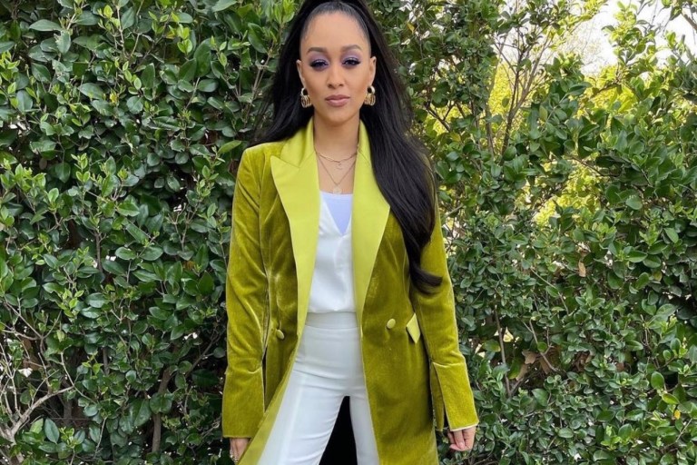 Tia Mowry Spotted Wearing Jonathan Simkhai White Look Paired With UNTTLD Green Velvet Belted Coat and Bottega Veneta Yellow Square-Toe Leather Sandals