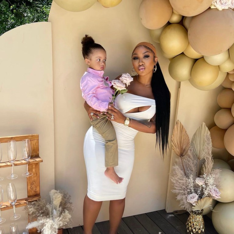 Ari Fletcher Celebrates Mother’s Day in Fashion Nova White Cutout One Shoulder Midi Dress