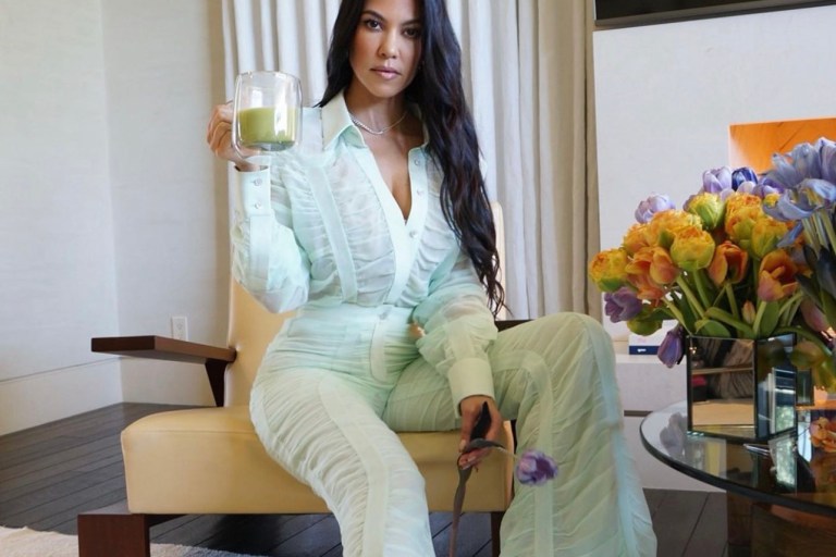 Kourtney Kardashian Promotes Her Poosh Brand Wearing Mint Green Ruched Blouse and Wide Leg Pants by Ferragamo