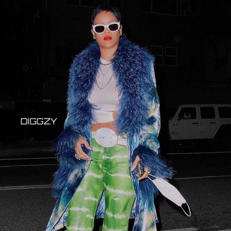 Rihanna Sports New Pixie Cut in LA Wearing Dior by John Galliano Fall 2000 Blue Tie-Dye Velvet Fur Jacket, Hyein Seo Cream Chain Top, Chrome Hearts Green Tie-Dye Leather Pants, R13 Western Buckle Belt and The Attico White Pumps
