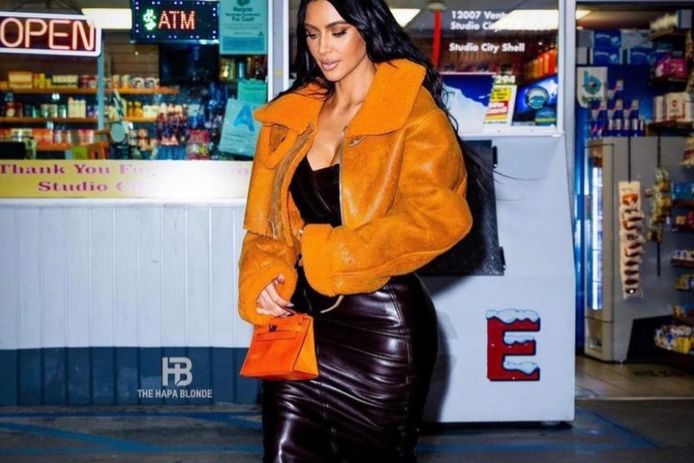 Kim Kardashian Spotted at a Gas Station in LA Wearing Yeezy Orange Shearling Jacket and Dior by John Galliano Brown Leather Strapless Dress