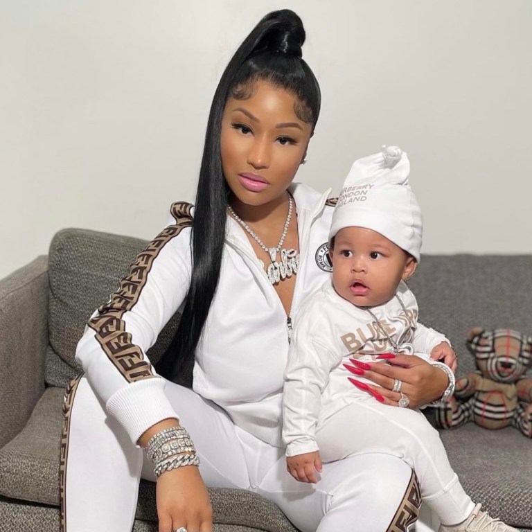 Nicki Minaj Holds Her Baby Boy Wearing Fendi Brown Logo Side-Stripe Track Jacket and Pants While ‘Papa Bear’ Looked Adorable in a Burberry Logo Onesie Set and Yeezy 380 Sneakers