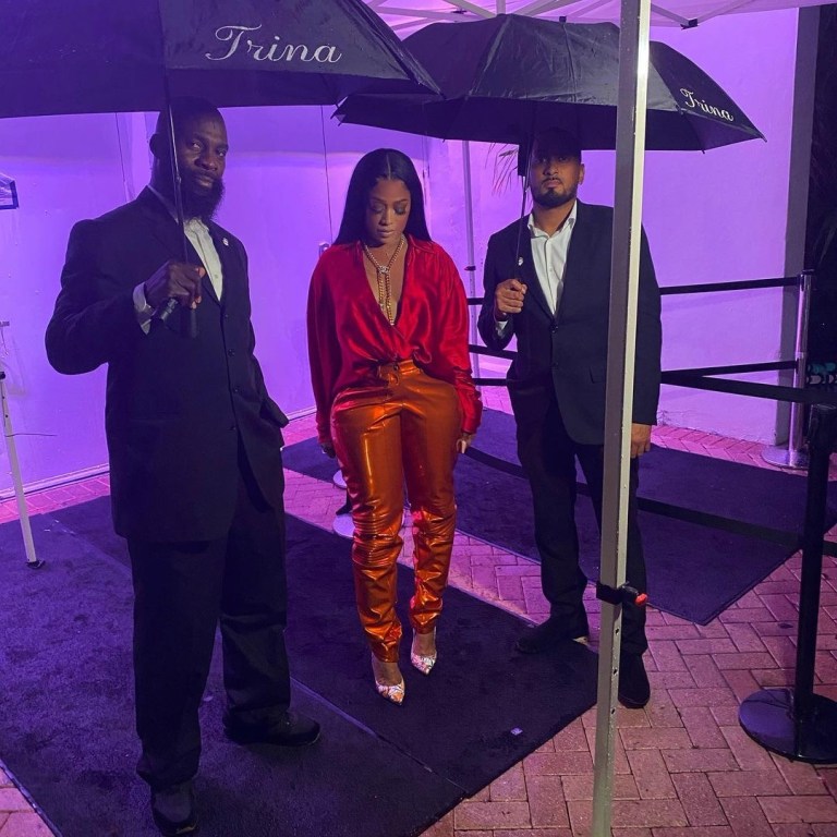 Trina and Eve Verzuz TV Fashion: Trina in LaQuan Smith Spring 2021 Red and Orange Look and Eve in Mugler Black Bodysuit With Paris Texas Green Crystal-Embellished Knee Boots