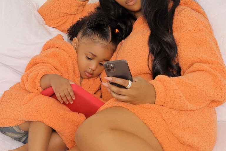 Brooke Valentine and Daughter Chí Keep It Cozy in Matching Fashion Nova Orange Fuzzy Dresses