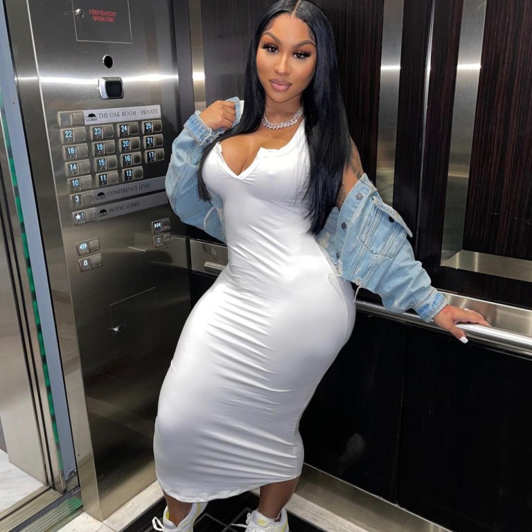 Ari Fletcher Goes for a Casual Look Wearing Fashion Nova White V-Neck Midi Dress