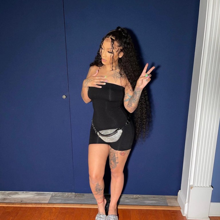 Cuban Doll Poses in Fashion Nova Black Tube Romper