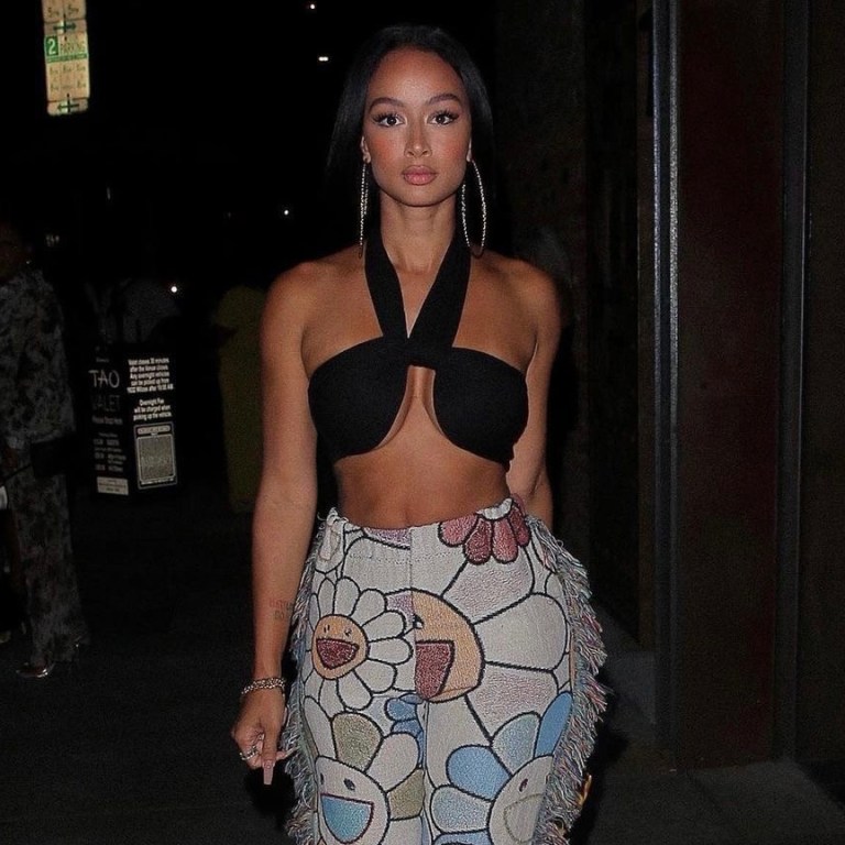 Wardrobe Inquiry: Draya Michele Heads Out for the Night in LA Wearing JLUXLABEL Black Bandeau Top and Murakami Tapestry Pants by Creations by Camyyo