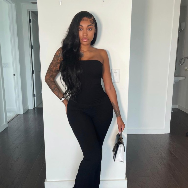 Jania Meshell Strikes a Pose in Fashion Nova Black Tube Lace-Up Jumpsuit
