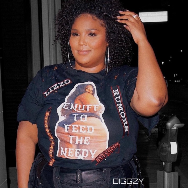 Lizzo Lets Us Know the Rumors Are True in Custom Black Stinson Haus Look Including Graphic T-Shirt and Leather Fringe Pants