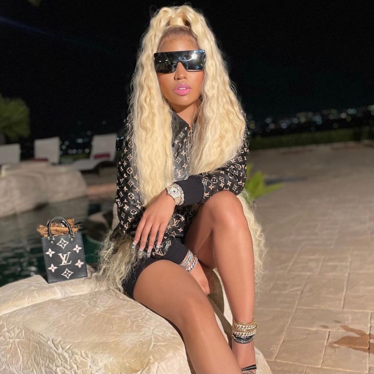 Nicki Minaj Promotes ‘Whole Lotta Money’ Remix Wearing Louis Vuitton Look Including Monogram Leather Bomber Jacket and Mini Monogram Handbag
