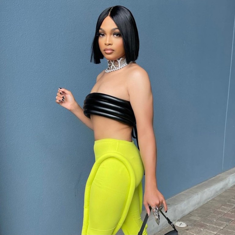 Wardrobe Inquiry: Alonzo Arnold Stuns in TLZ L’Femme Look Featuring Black Stacked Tube Bandeau Top and Lime Green Leggings