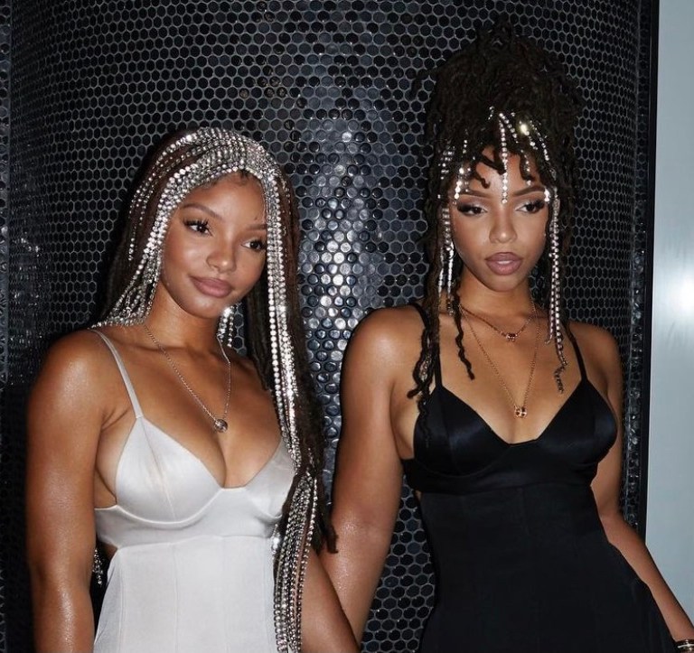 Chloe and Halle Attend the Bvlgari B.zero1 New York Fashion Week Event Wearing Peter Do Fall 2021 Dresses and Area Crystal Headpieces