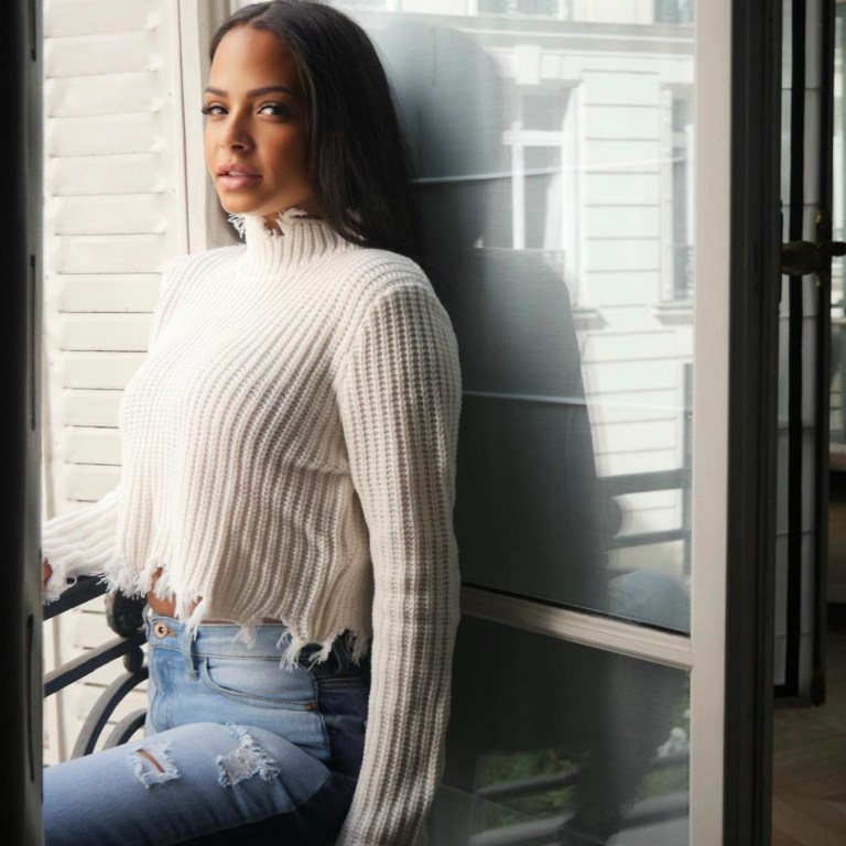 Christina Milian Chills in Style Wearing Fashion Nova White Distressed Turtleneck Sweater