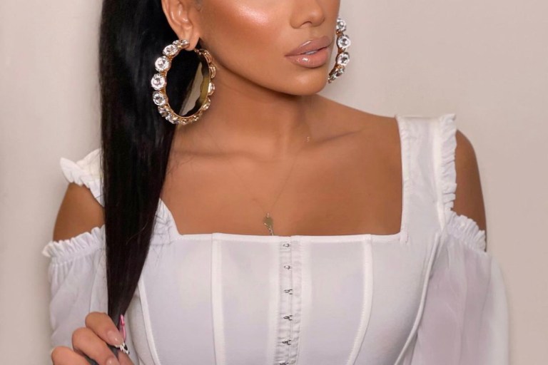 Cyn Santana Serves Face in Fashion Nova White Ruffled Corset Top