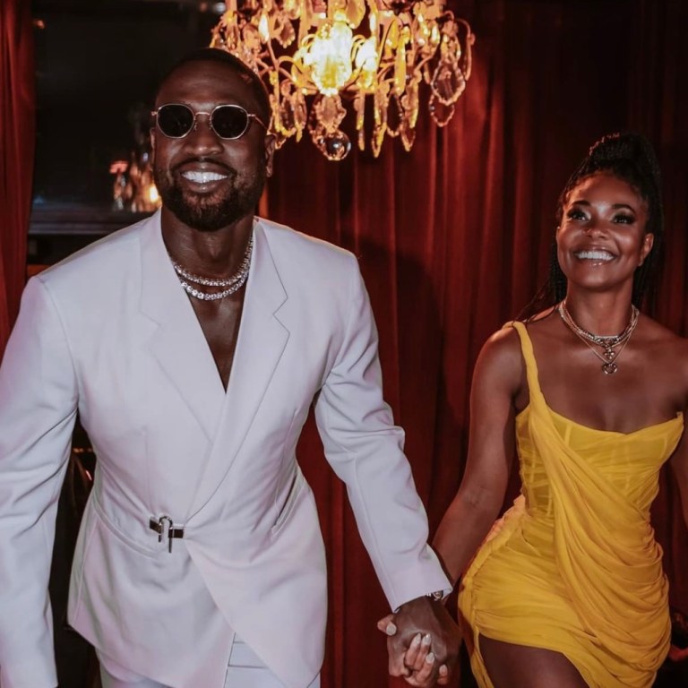 Wardrobe Inquiry: Gabrielle Union Radiates in Cong Tri Fall 2021 Yellow One Shoulder Draped Dress While Celebrating Anniversary With Dwyane Wade in Paris