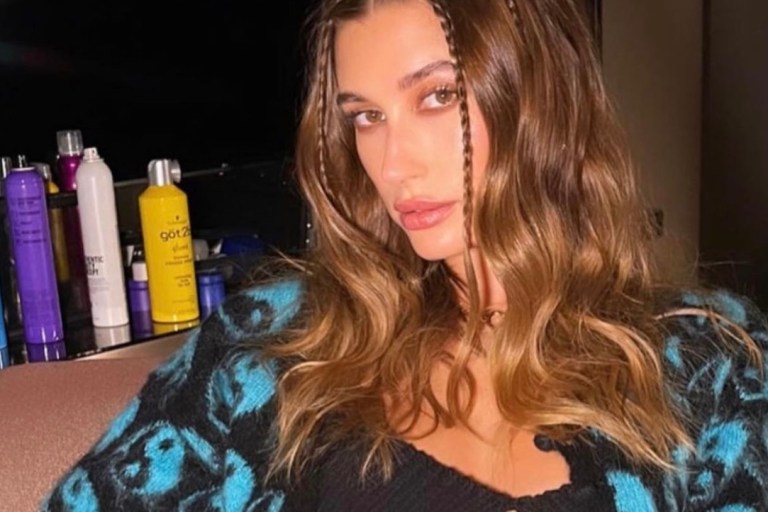 Hailey Bieber Wears Kunst Black Knit Top Paired With Ashley Williams Yin and Yang Crop Cardigan and Balenciaga Logo Jeans to Made In America Festival