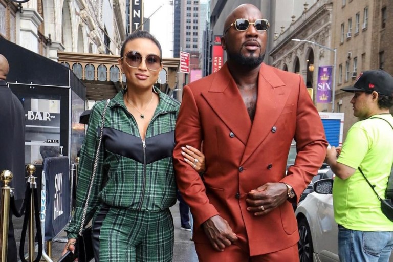 Wardrobe Inquiry: Jeannie Mai Hits the Streets With Jeezy During New York Fashion Week Wearing Chiara Boni La Petite Robe Green Plaid Zip Up Jacket and Wide Leg Pants
