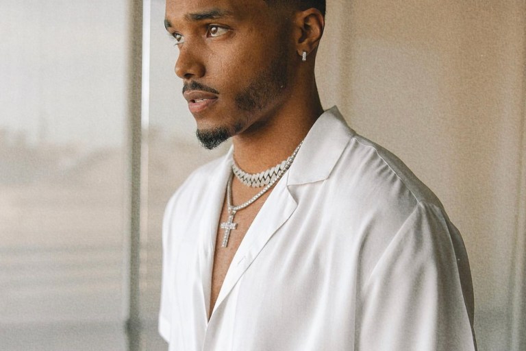 Rome Flynn Keeps It Fly in a Fashion Nova White Button Shirt