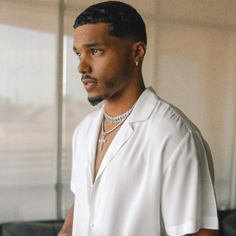 Rome Flynn Keeps It Fly in a Fashion Nova White Button Shirt