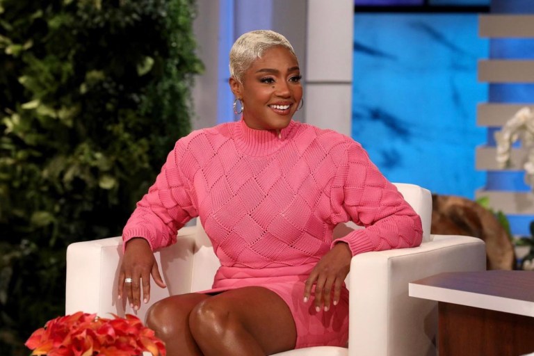 Wardrobe Inquiry: Tiffany Haddish Appears on Ellen DeGeneres’ Show Wearing Herve Leger Pink Knit Bandage Mini Dress