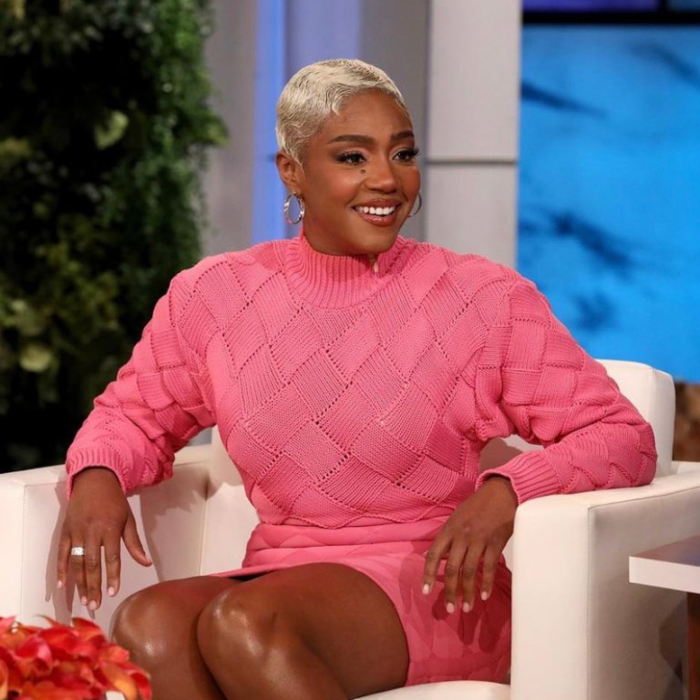 Wardrobe Inquiry: Tiffany Haddish Appears on Ellen DeGeneres’ Show Wearing Herve Leger Pink Knit Bandage Mini Dress