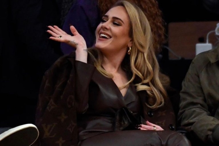 Adele Attends Lakers and Warriors Game Wearing Louis Vuitton Brown Monogram Wool Coat and Pumps