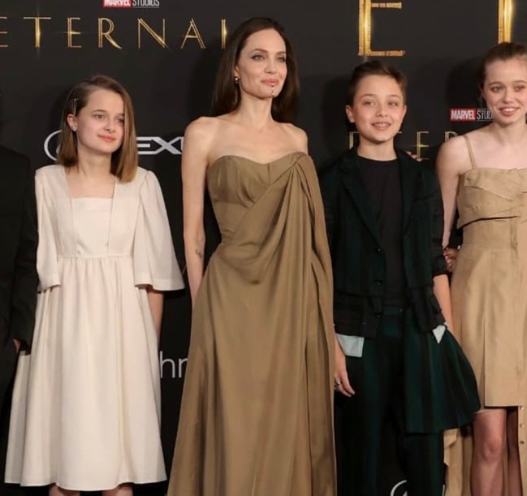 Angelina Jolie Attends LA Premiere of ‘Eternals’ With Her Kids, Wearing Balmain Resort 2022 Brown Draped Corset and Pants Look + Zahara Jolie-Pitt Rocks Mom’s 2014 Oscars Dress by Elie Saab