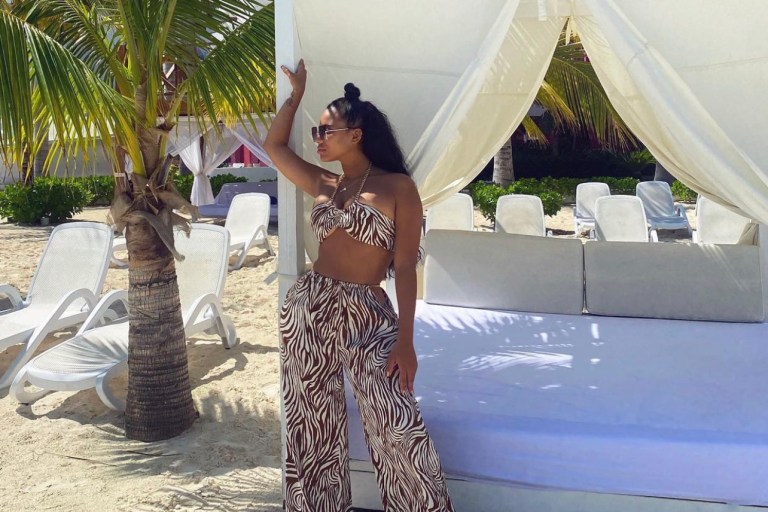 Cyn Santana Enjoys Vacation in Cancun Wearing Fashion Nova Animal Print Chain Halter Top and Wide Leg Pant Set