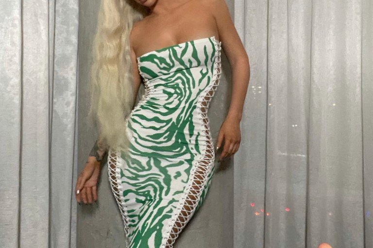 Iggy Azalea Poses in Fashion Nova Green and White Animal Print Lace-Up Tube Dress