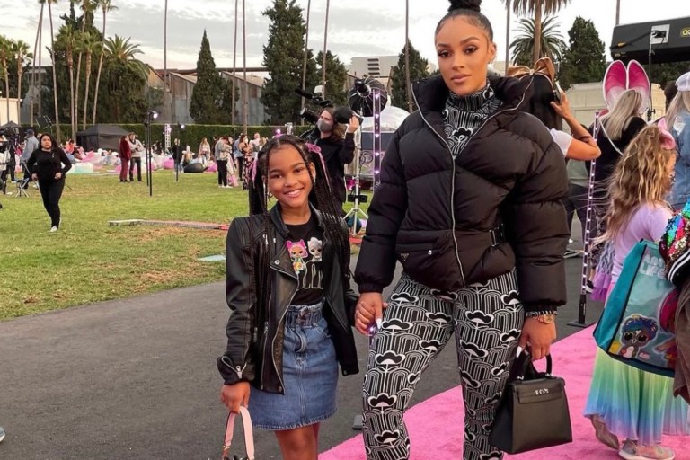 Joie Chavis Attends the LOL Surprise! Movie Premiere With Daughter Shai Wearing Prada Black and White Floral Print Jacquard Jumpsuit and Black Puffer Jacket + K. Michelle Spotted in Prada Floral Pieces