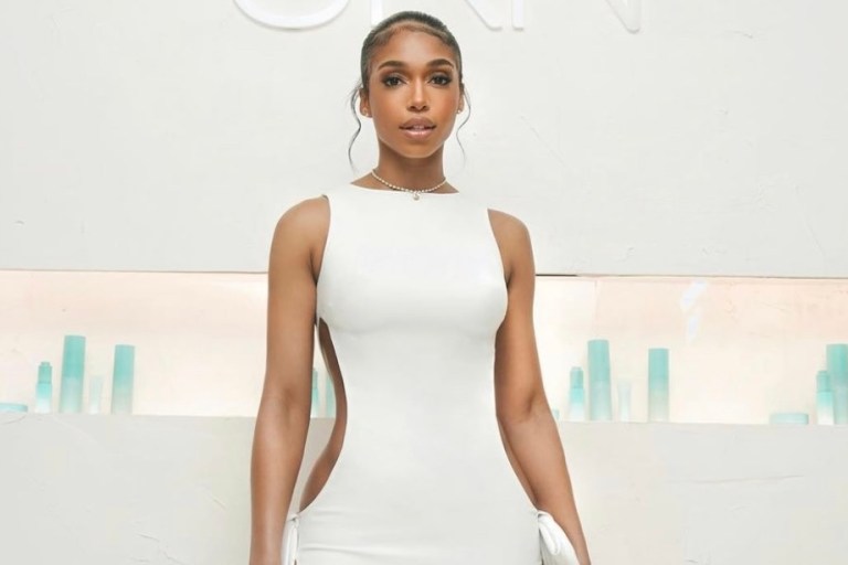 Wardrobe Inquiry: Lori Harvey Dons Monot Spring/Summer 2022 White Cutout Bow Dress to Her SKN by LH Launch Party