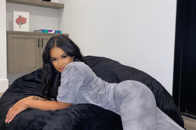 Taina Williams Lounges in Fashion Nova Grey T-Shirt and Legging Set