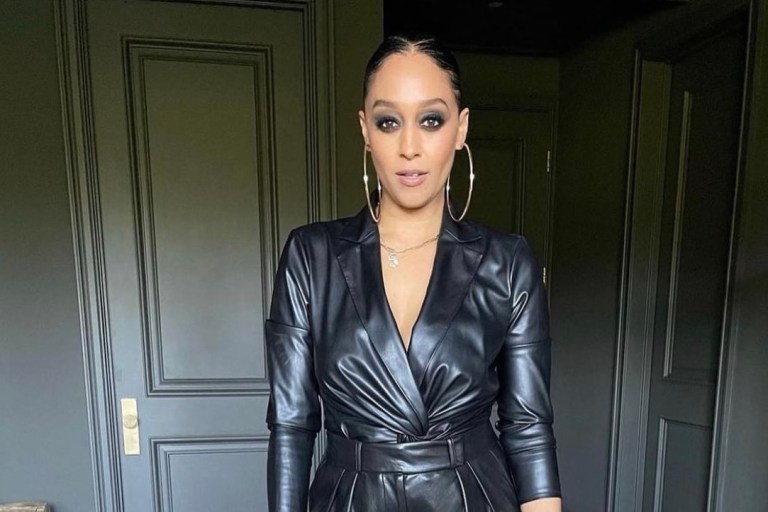 Wardrobe Inquiry: Tia Mowry Rocks Black Leather Look Featuring Donna Karan Twist Top and Alice and Olivia High Waisted Pleated Pants While Attending Variety’s 2021 Women of Power Event