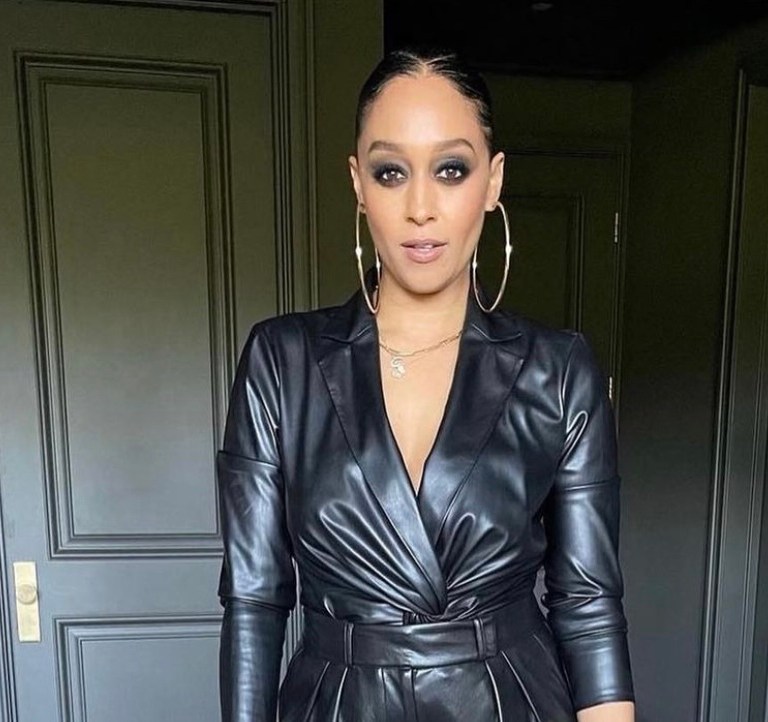 Wardrobe Inquiry: Tia Mowry Rocks Black Leather Look Featuring Donna Karan Twist Top and Alice and Olivia High Waisted Pleated Pants While Attending Variety’s 2021 Women of Power Event