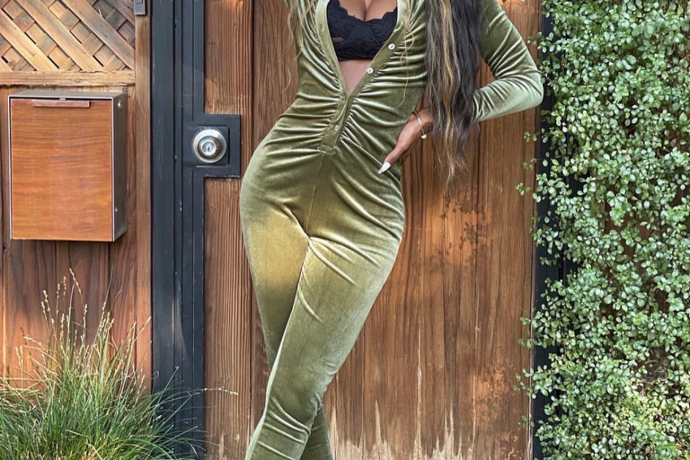Yahné Coleman Poses in Fashion Nova Green Velvet Ruched Jumpsuit