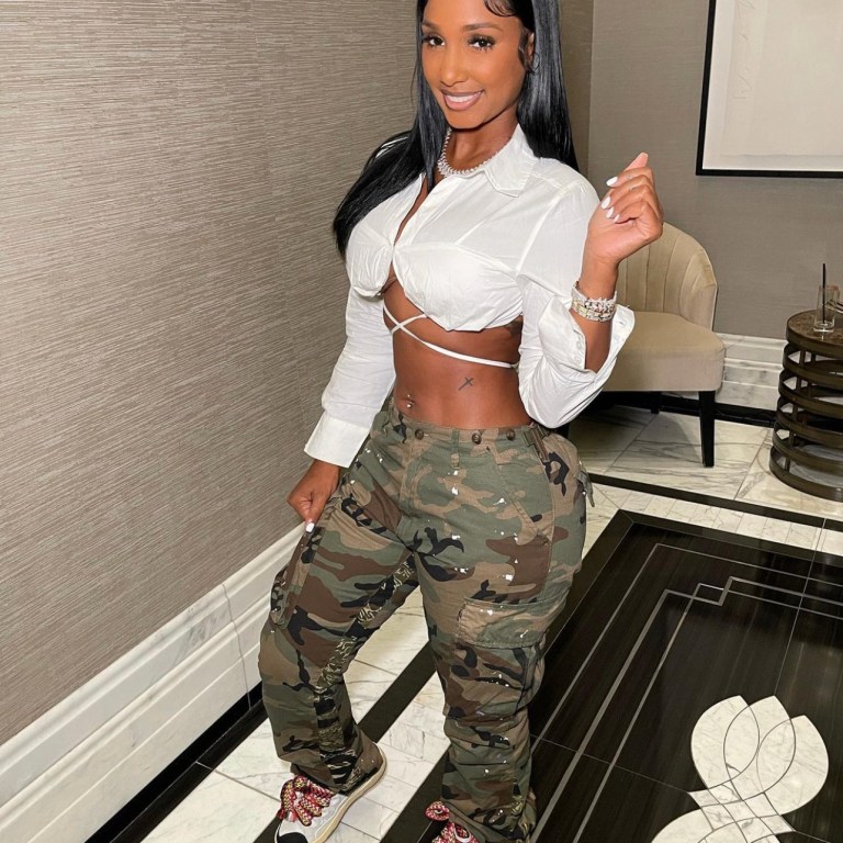 Bernice Burgos Spotted in Fashion Nova White Wraparound Tie Cropped Shirt, Camouflage Pants, and Sneakers