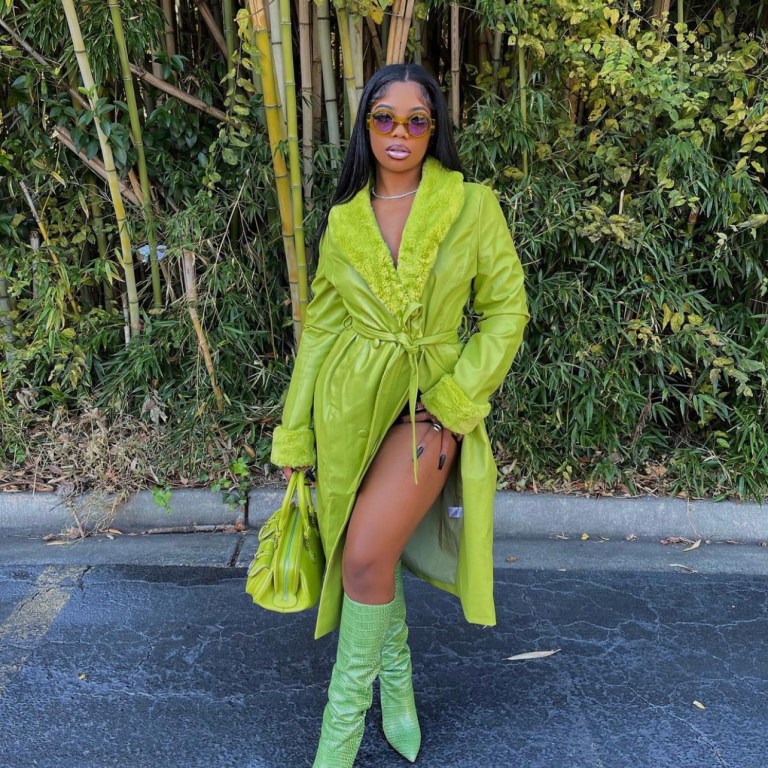De’arra Taylor Goes All Green With Latest Look Featuring Fashion Nova Lime Green Fur-Trim Faux Leather Trench Coat