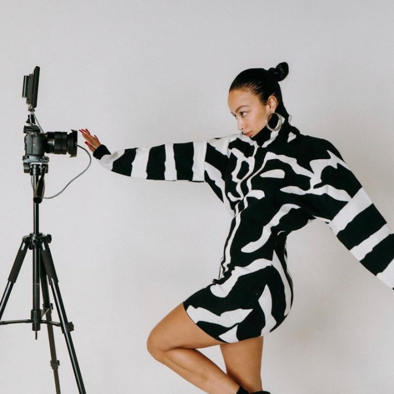 Draya Michele Spotted in Fashion Nova Black and White Turtleneck Mini Sweater Dress