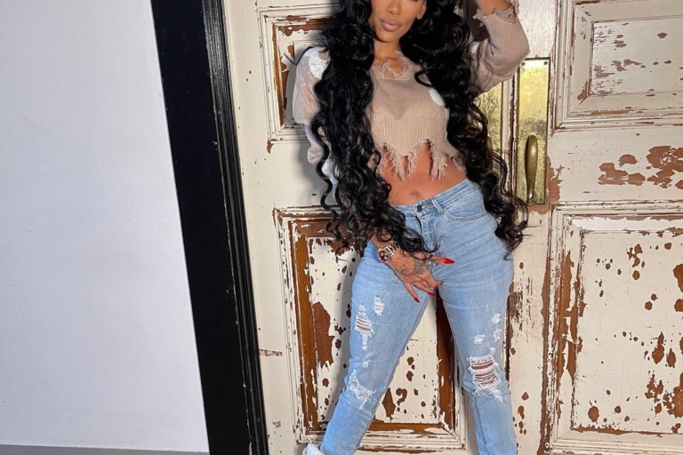 Erica Mena Poses in Casual Look Featuring Fashion Nova Star Print Distressed Cropped Sweater