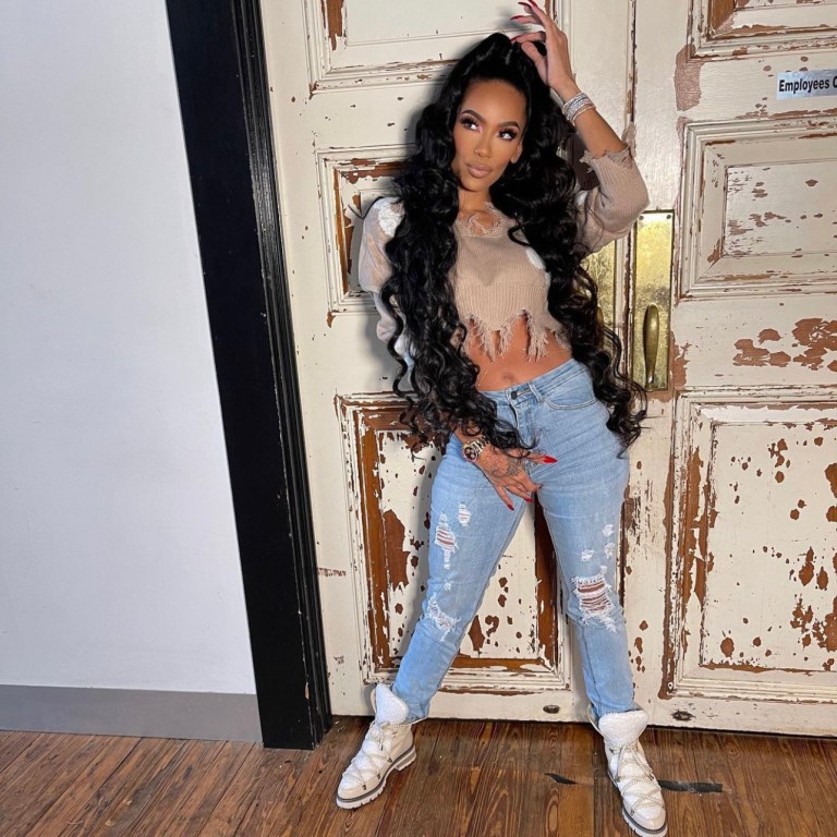 Erica Mena Poses in Casual Look Featuring Fashion Nova Star Print Distressed Cropped Sweater