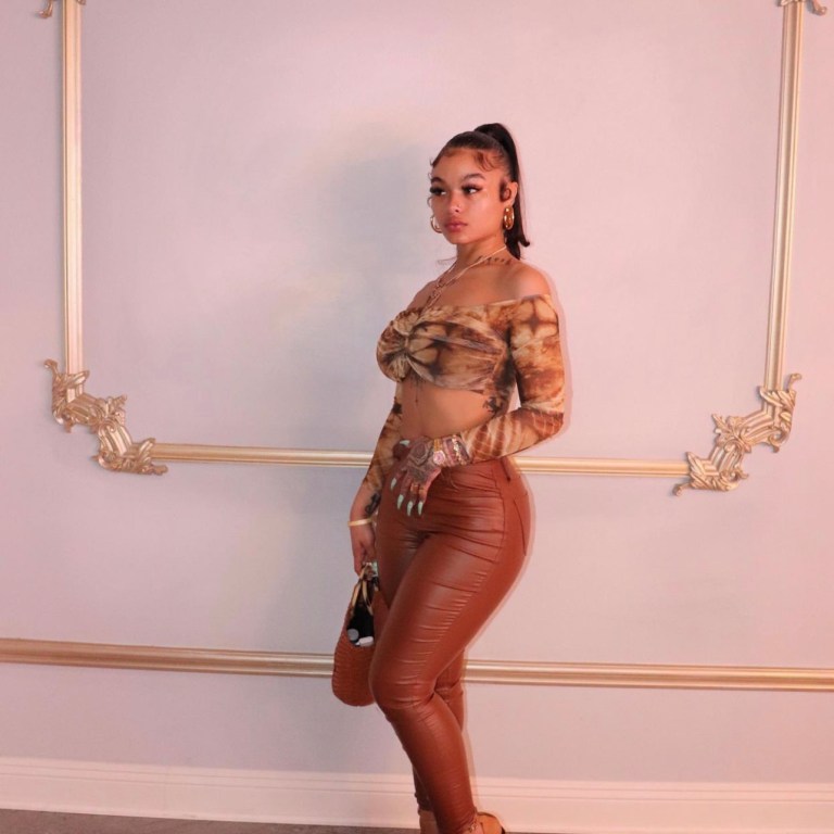 India Love Wears Fashion Nova Tie-Dye Off-the-Shoulder Top and Brown Leather Pants During Outing