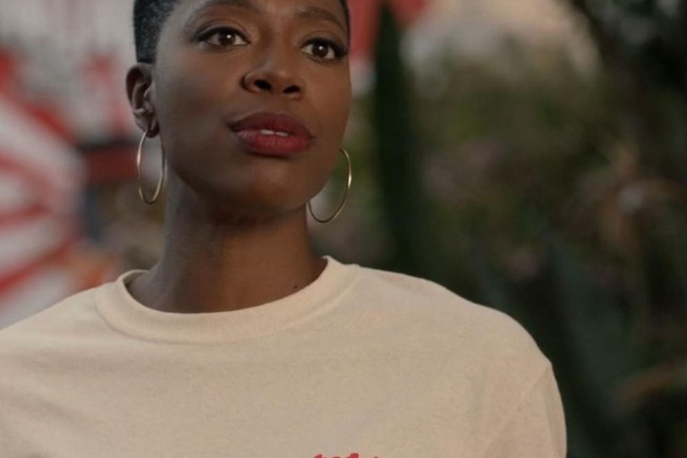 Insecure Season 5 Episode 2 Fashion Credits: Issa Rae in K.ngsley White Cutout Tank, Thebe Magugu Black and Blue Printed Blazer, and Jonathan Simkhai Teal Cutout Turtleneck + Yvonne Orji in MindfulFee ‘Somebody’s Auntie’ Tee, Christopher John Rogers Royal Blue Blazer, Custom Aliétte Silk Printed Set and More