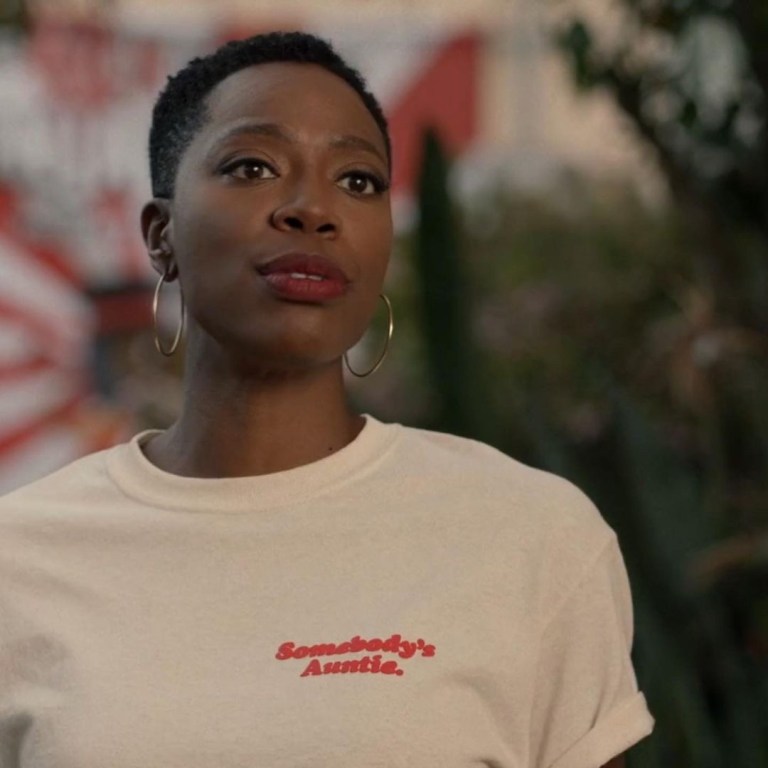 Insecure Season 5 Episode 2 Fashion Credits: Issa Rae in K.ngsley White Cutout Tank, Thebe Magugu Black and Blue Printed Blazer, and Jonathan Simkhai Teal Cutout Turtleneck + Yvonne Orji in MindfulFee ‘Somebody’s Auntie’ Tee, Christopher John Rogers Royal Blue Blazer, Custom Aliétte Silk Printed Set and More