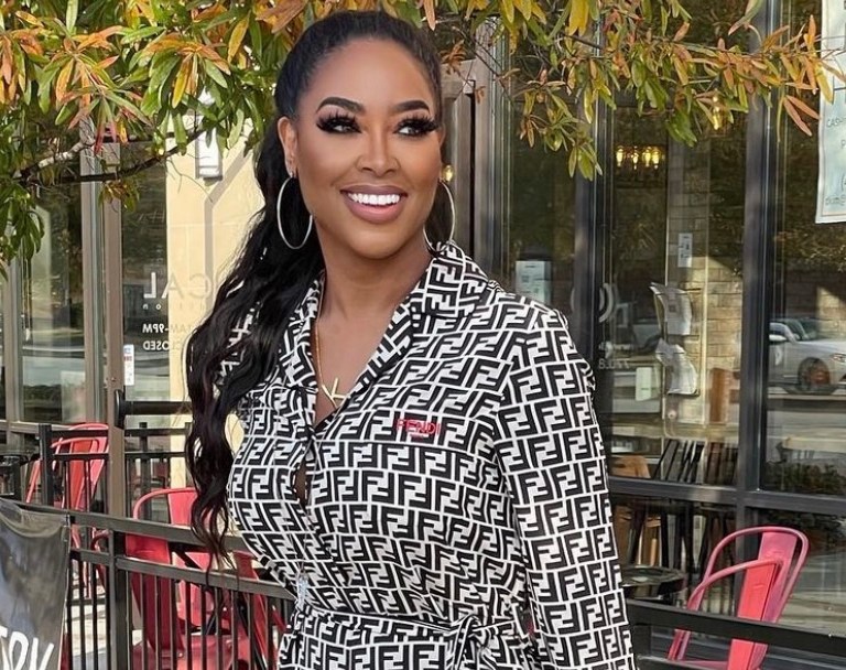 Kenya Moore Wears Fendi Black and White Logo Jumpsuit and Dsquared2 Red Lace-Up Sandals During Day Out