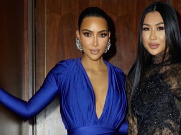 Kim Kardashian Attends Simon Huck and Phil Riportella’s Pre-Wedding Event Wearing Balenciaga Fall/Winter 2020 Blue Satin Look