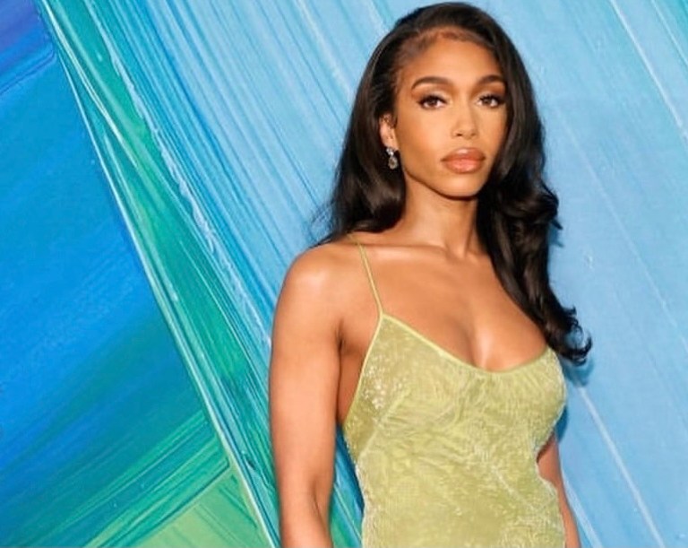 Lori Harvey Wears Vintage Roberto Cavalli Fall/Winter 1999 Green Fur Hem Dress to the 2021 amfAR Gala